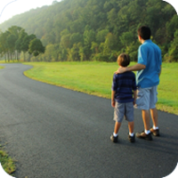 image of man and child walking together.