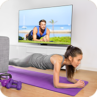 image of woman exercising at home.